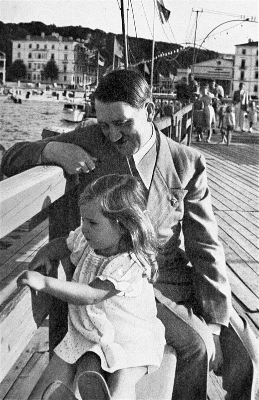 Adolf Hitler with Helga Goebbels during a walk on Heiligendamm beach